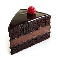 A decadent slice of chocolate cake with multiple layers of moist chocolate sponge and rich, creamy ganache. The glossy chocolate glaze drips slightly down the sides, and a single raspberry sits atop for a touch of color. Isolated on clean white background photo
