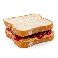 A classic peanut butter and jelly sandwich made with soft white bread. The creamy peanut butter and sweet strawberry jam ooze slightly from the edges, creating a nostalgic childhood favorite. Isolated on clean white background photo