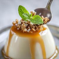 A close-up of a creamy panna cotta al caramello dessert, a smooth and delicate Italian dessert, made with heavy cream, sugar, and gelatin, infused with vanilla and topped with a rich and buttery caramel sauce, drizzled generously over the panna cotta, and photo