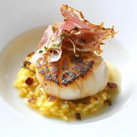 A tasting menu course featuring a seared scallop, served on a bed of saffron risotto, drizzled with truffle oil, and garnished with crispy prosciutto and shaved parmesan, presented in a small, elegant bowl, highlighting the richness and complexity of flav photo