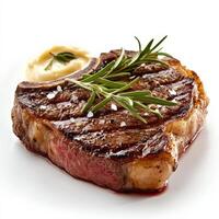 A perfectly seared ribeye steak with a caramelized crust and a juicy, medium-rare center. The steak is garnished with fresh rosemary and served with a side of garlic butter, making for an indulgent, restaurant-quality meal. Isolated on clean white backgro photo