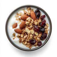 Granola with yogurt, almonds and cranberries in a bowl on a white background photo