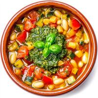 Italian vegetable soup with basil and tomatoes in a bowl on white background photo