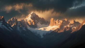Majestic Snow-capped Mountains Bathed in Golden Light Under Dramatic Clouds photo