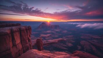 Dramatic Sunrise Over Rocky Canyon Landscape with Cloud Inversion Layer photo
