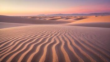 Sand Dune Landscape with Patterned Sand at Sunset or Sunrise photo