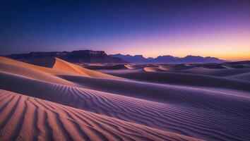 Desert Sand Dunes at Dusk with Starry Sky and Distant Mountains photo