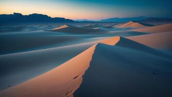 Sand Dunes Landscape in Desert with Mountains and Sunset photo
