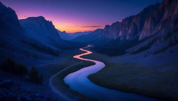 River Flowing Through Valley at Dusk with Mountains in Distance photo