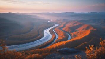 Scenic River Bends Through Mountainous Terrain at Sunset with Golden Light photo