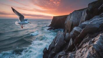 Seagull Flying Over Ocean Waves by Rocky Cliffs at Sunset photo