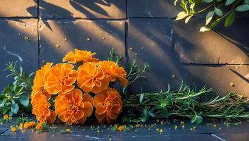 Orange Flowers Arrangement with Rosemary and Greenery on Dark Tile photo