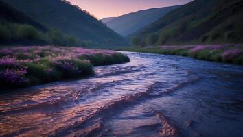 River Flows Through Mountain Valley with Blooming Meadow photo