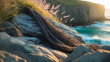 Fishing Net on Rocky Coastline with Waves and Cliff Landscape photo