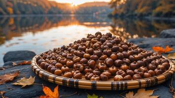 Autumn Harvest Pile of Persimmons Near Lake at Sunset photo