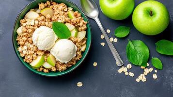 Apple crisp being served with ice cream in bowl green apples, leaves, oatmeal on table background photo