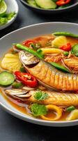 Fish in bowl with veggies, spicy meal with pineapples peppers. Food photography cookbook use photo
