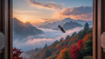 Eagle Flying Over Mountain Ridge at Sunrise Seen Through Window photo