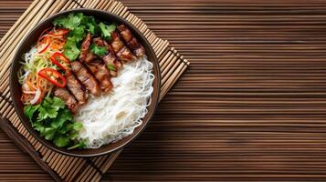 Grilled beef with noodles and vegetables in a bowl on bamboo placemat for lunch marketing photo