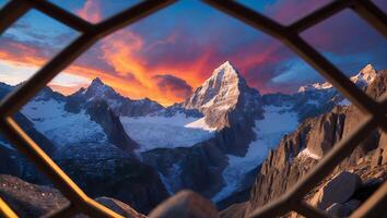 Viewing Snow Capped Mountains Through Lattice with Colorful Sunset Skies photo