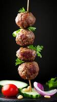 Meatballs on a skewer with veggies against a dark background, suitable for food presentations photo