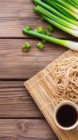 Noodles with greens and sauce served on mat, cooking blog, recipe, food photography photo