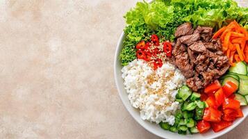 Nutritious bowl with meat and vegetables on a table. For healthy eating or recipe blogs photo