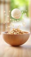 Oats in bowl grains falling, scoop hovering, on wooden table, soft background photo