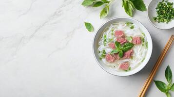 Pho served with beef and basil leaves on a table, used for menu, restaurant advertisements photo