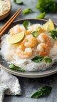 Prawns with rice noodles and lime slices, arranged on a dish for culinary use and healthy eating photo