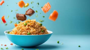 Rice with meat, peas and carrot, falling vegetables with clean cyan background for recipe websites photo