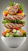 Salad with grilled chicken floating above bowl, on table. For diet, nutrition projects photo