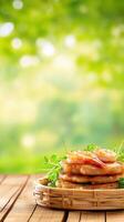 Shrimp and grits stack with green garnish on a wood table, with a blurred park scene background photo
