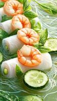 Shrimp spring rolls with fresh basil and cucumber on noodles. Use for healthy food promotion photo