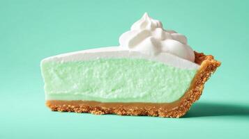 Slice of key lime pie with whipped cream against an plain light blue background, suitable for ads photo