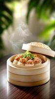 Steaming dim sum served in bamboo steamer on a wooden table with a natural background photo