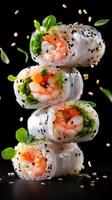 Sushi rolls stacked with shrimp and vegetables on a black background for a menu or recipe photo