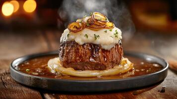 Tasty steak topped with puree and onion rings in dark light on plate for food menu background photo
