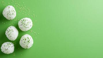 Top view of rice balls with herbs on green background. Use for healthy recipe ideas photo