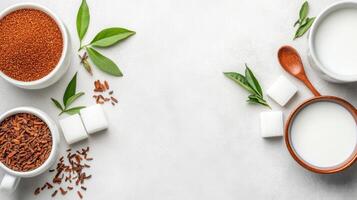 Top view of sugar and tea with milk on white table, possible health or diet use photo