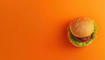 Top View Homemade Burger. Bun With Sesame Seeds, Meat, Cheese, Lettuce, Tomato And Cheese Sauce, Freshly Made And Ready To Eat photo