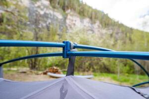 A CloseUp View of a Tent Canopy and Its Support Structure Nestled Within a Beautiful Natural Setting, Perfectly Capturing the Essence of Outdoor Adventures and Camping Experiences photo