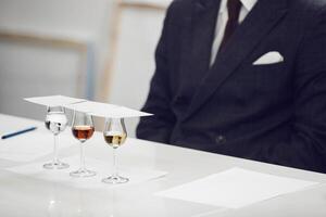 Sophisticated Spirits Tasting Event, Close up. Degustation Glasses with Various Untitled Alcoholic Drinks on the Table. photo