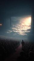 Crowd watches a stunning visual performance with dramatic clouds and light at a theater during evening hours photo
