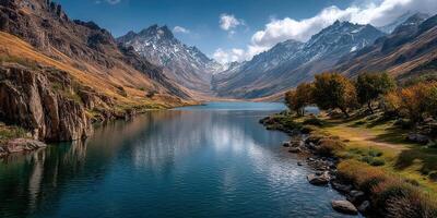 Breathtaking mountain lake landscape reflects majestic peaks at midday with serene waters and lush greenery photo