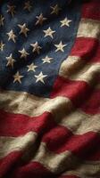 Textured fabric of an American flag draping gracefully with vivid stars and stripes in a warm light photo