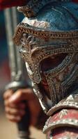 Ancient warrior in ornate armor brandishing sword outdoors during historical reenactment event photo