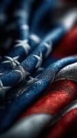 Textile details of a gently folded American flag showing vibrant colors and intricate stitching photo