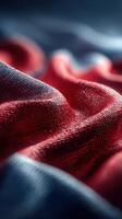 Textured fabric draped elegantly with rich colors, showcasing waves and folds in intricate detail photo