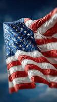 American flag waving against a clear blue sky with bright stars and stripes highlighting national pride and unity photo
